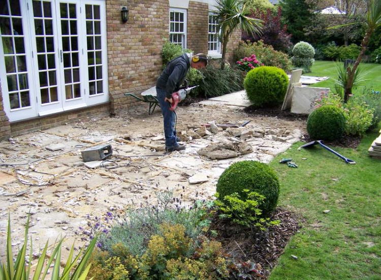 Fossil Mint Sandstone Paving in Cobham, Surrey - A rear terrace relaid using the original Fossil Mint Sandstone paving. Garden Paving - MDB Landscapes