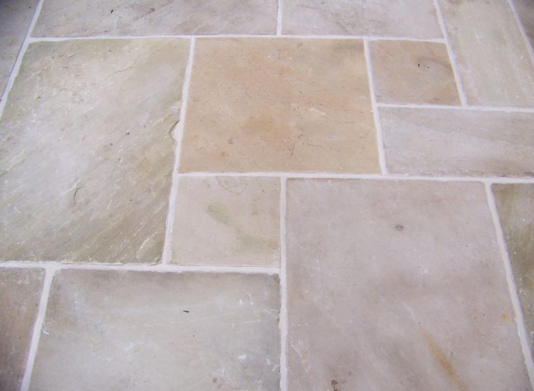 Fossil Mint Sandstone Paving in Cobham, Surrey - A rear terrace relaid using the original Fossil Mint Sandstone paving. Garden Paving - MDB Landscapes