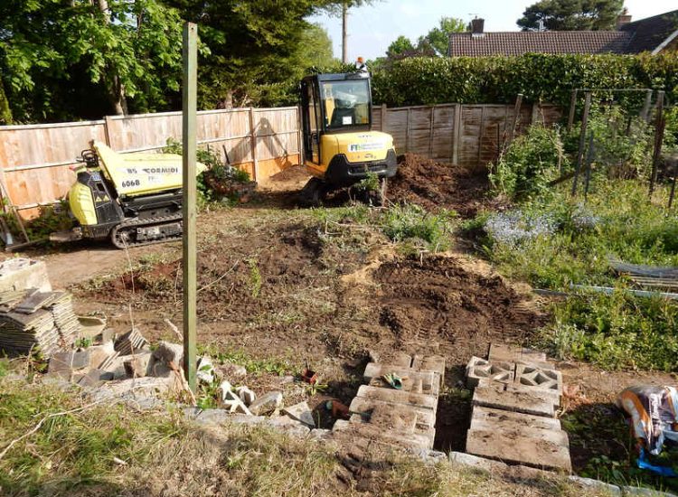 Garden Clearance in Little Bookham, Leatherhead, Surrey - Major clearance of mature trees, shrubs with roots extracted, ponds cleared and filled prior to other works. Garden clearance for Surrey and Hampshire - MDB Landscapes