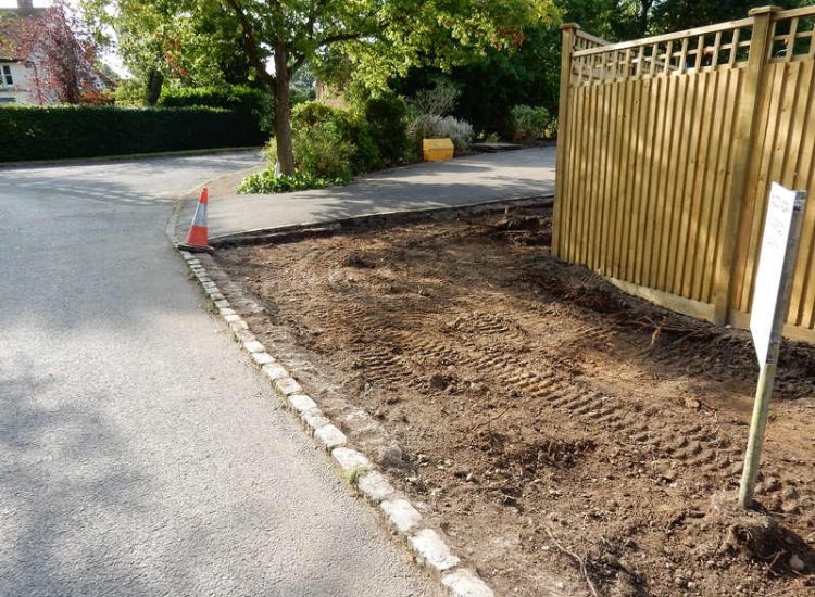 Instant Holly Hedging in Little Bookham, Surrey - Total transformation of an altered boundary line replacing rhododendrons and large conifer trees with Ilex aquifolium hedging. Garden plants and planting for Surrey and Hampshire - MDB Landscapes