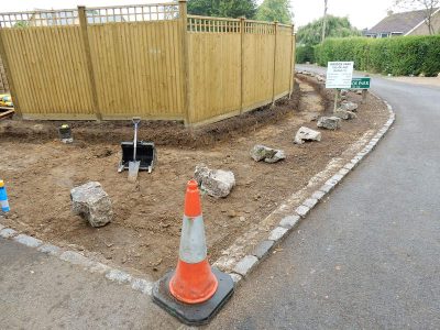 Instant Holly Hedging in Little Bookham, Surrey - Total transformation of an altered boundary line replacing rhododendrons and large conifer trees with Ilex aquifolium hedging. Garden plants and planting for Surrey and Hampshire - MDB Landscapes