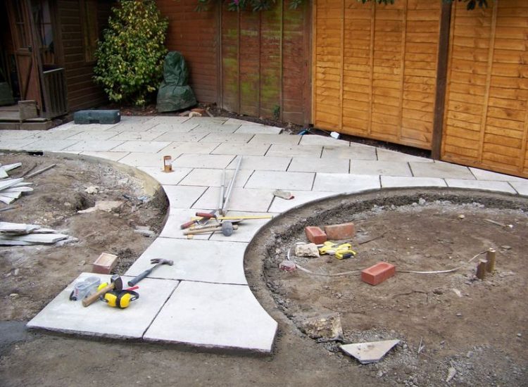 Garden Paving in Fleet, Hampshire - Kota Brown Limestone paving and cropped 200x100x100mm granite setts used. Garden Paving - MDB Landscapes