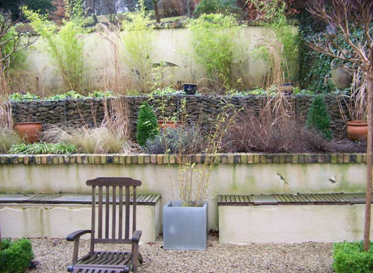 Trellis Work in Godalming, Surrey - Large surface areas of retaining wall visually altered with the use trellis panels and mirrors. Garden Fencing - MDB Landscapes