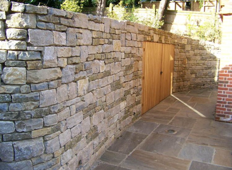 Cropped and Split Faced Stone Walling in Bramley, Surrey - Stone walling facing reinforced blockwork retaining walls. Garden Walling - MDB Landscapes