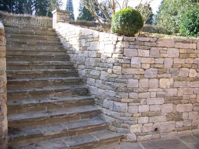 Cropped and Split Faced Stone Walling in Bramley, Surrey - Stone walling facing reinforced blockwork retaining walls. Garden Walling - MDB Landscapes