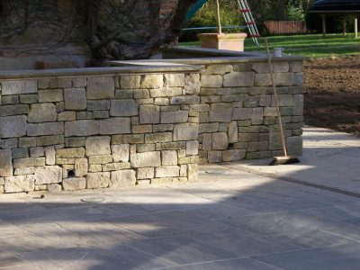 Cropped and Split Faced Stone Walling in Bramley, Surrey - Stone walling facing reinforced blockwork retaining walls. Garden Walling - MDB Landscapes
