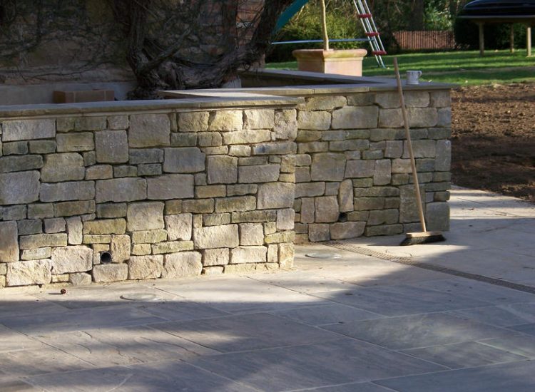 Cropped and Split Faced Stone Walling in Bramley, Surrey - Stone walling facing reinforced blockwork retaining walls. Garden Walling - MDB Landscapes