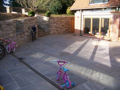 Cropped and Split Faced Stone Walling in Bramley, Surrey - Stone walling facing reinforced blockwork retaining walls. Garden Walling - MDB Landscapes