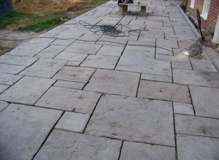 Reclaimed Yorkstone Paving in Dippenhall, Farnham, Surrey - A large rear terrace relaid using traditional reclaimed English Yorkstone. Garden Paving - MDB Landscapes