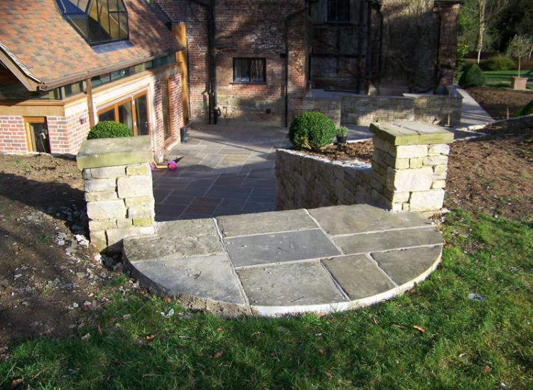 New Yorkstone Paving in Bramley, Surrey - Six sided sawn new Yorkstone paving was used here through out the rear and front gardens. Garden Paving - MDB Landscapes
