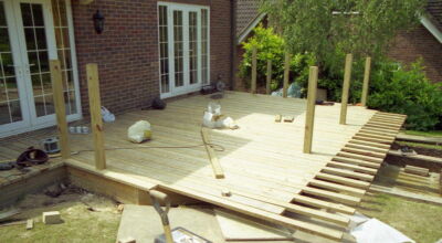 Timber Decking in Odiham, Hampshire - Yellow Southern Yellow Pine timber decking with balustrade, handrail, steps and water feature. Timber decking - MDB Landscapes