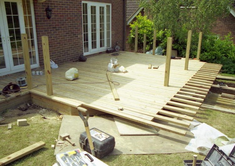 Timber Decking in Odiham, Hampshire - Yellow Southern Yellow Pine timber decking with balustrade, handrail, steps and water feature. Timber decking - MDB Landscapes