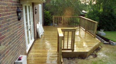 Timber Decking in Odiham, Hampshire - Yellow Southern Yellow Pine timber decking with balustrade, handrail, steps and water feature. Timber decking - MDB Landscapes