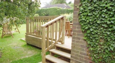 Timber Decking in Odiham, Hampshire - Yellow Southern Yellow Pine timber decking with balustrade, handrail, steps and water feature. Timber decking - MDB Landscapes