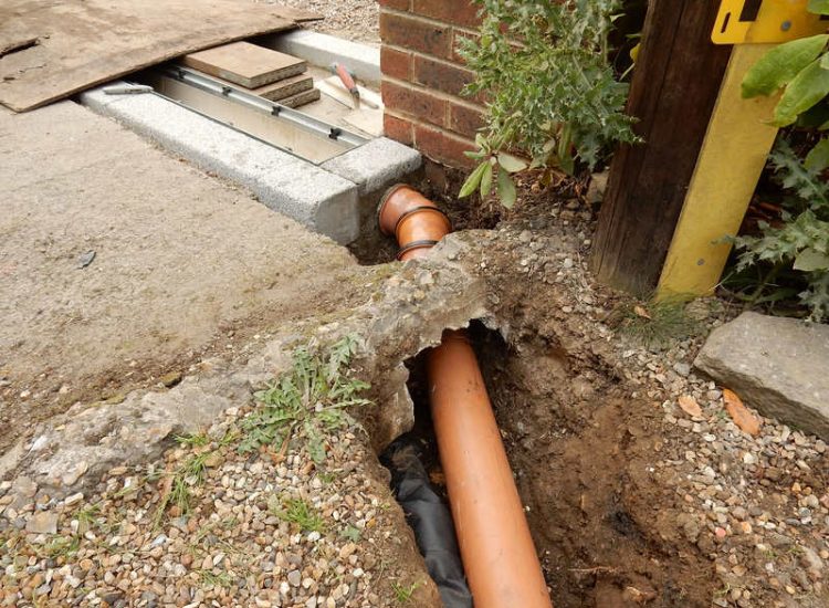 Driveway Drainage Esher, Surrey - As part of further drainage works within the rear garden of this property surface water linear drainage was installed along the entrance of the property within a new granite set cross over area. Garden drainage - MDB Landscapes