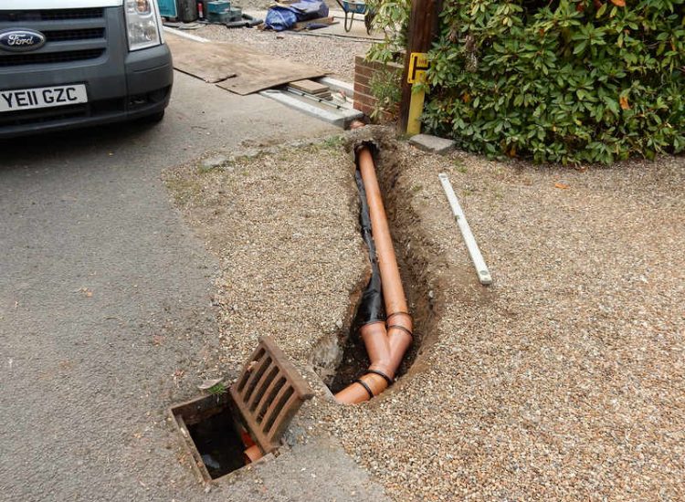 Driveway Drainage Esher, Surrey - As part of further drainage works within the rear garden of this property surface water linear drainage was installed along the entrance of the property within a new granite set cross over area. Garden drainage - MDB Landscapes