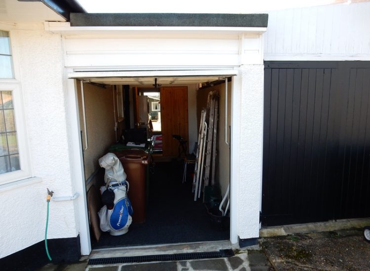 Driveway Drainage Ewell, Epson, Surrey - Constant flooding of a garage created an interesting requirement of how to manage and disperse the water. Our proposal was to install a new sump and pump with adjoining linear surface drainage. Collected water was then pumped over the garage to finally disperse into a rear garden outlet. Garden Drainage - MDB Landscapes