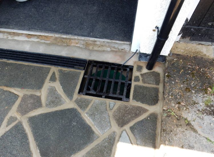 Driveway Drainage Ewell, Epson, Surrey - Constant flooding of a garage created an interesting requirement of how to manage and disperse the water. Our proposal was to install a new sump and pump with adjoining linear surface drainage. Collected water was then pumped over the garage to finally disperse into a rear garden outlet. Garden Drainage - MDB Landscapes