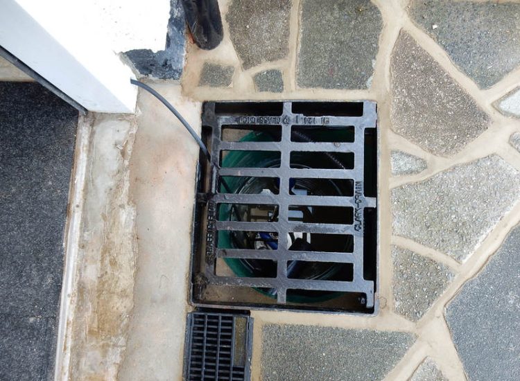 Driveway Drainage Ewell, Epson, Surrey - Constant flooding of a garage created an interesting requirement of how to manage and disperse the water. Our proposal was to install a new sump and pump with adjoining linear surface drainage. Collected water was then pumped over the garage to finally disperse into a rear garden outlet. Garden Drainage - MDB Landscapes