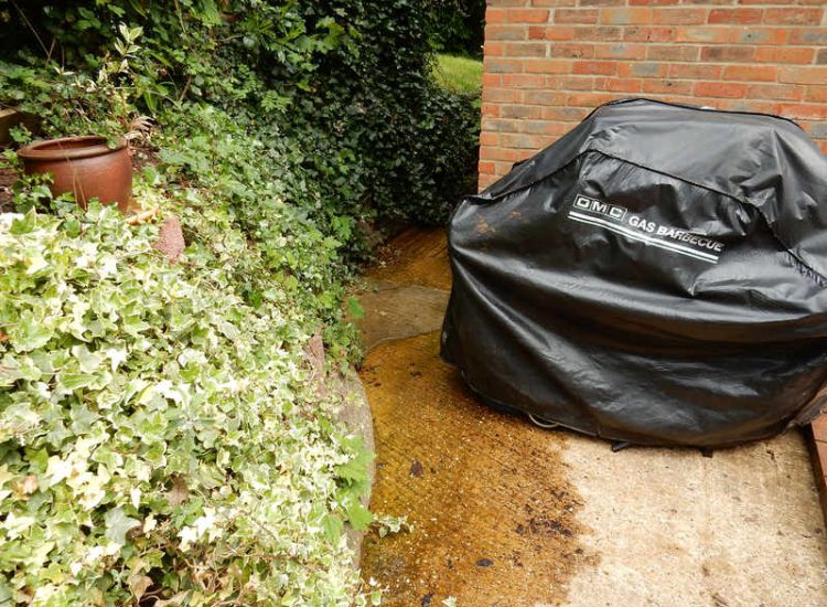 Garden Drainage Farnham, Surrey - Trapped water behind retaining walls was constantly seeping through flooding areas around the house. The most cost effective solution for the client was to catch the flow of water house side of retaining wall and divert it into a brook. Garden Drainage -MDB Landscapes