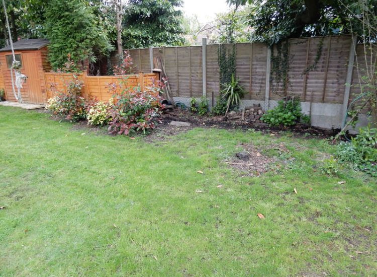 Garden Drainage Farnham, Surrey - A constant flow of in ground and over ground water was diverted to an existing culvert within the rear garden. Garden Drainage - MDB Landscapes