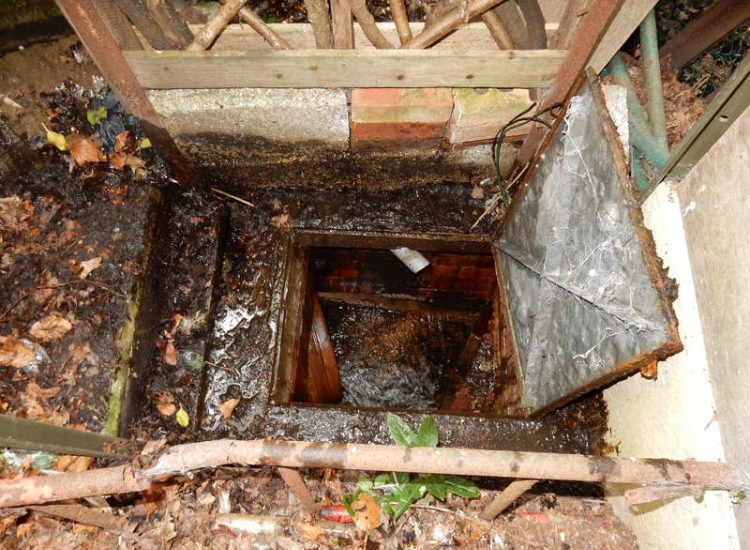 Garden Drainage Farnham, Surrey - A constant flow of in ground and over ground water was diverted to an existing culvert within the rear garden. Garden Drainage - MDB Landscapes