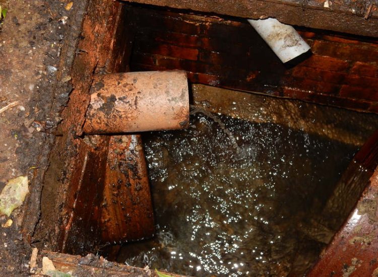 Garden Drainage Farnham, Surrey - A constant flow of in ground and over ground water was diverted to an existing culvert within the rear garden. Garden Drainage - MDB Landscapes