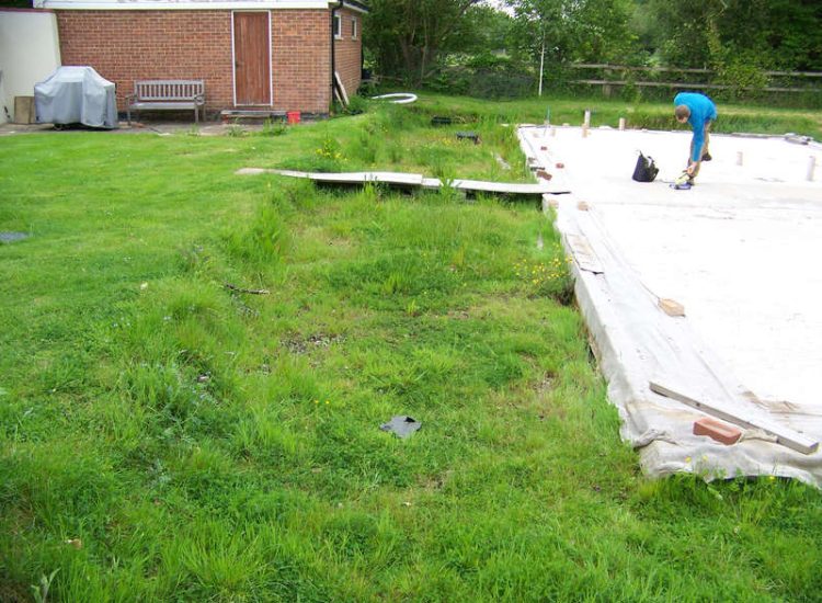 Drainage Layers and Lawn Drainage, Chobham, Surrey - The remit here was to install drainage around a new oak barn build prior to installation and for future drainage safe guards. Extensive lawn areas required land drainage to improve upon consitantly water logged areas of the garden. Garden Drainage - MDB Landscapes