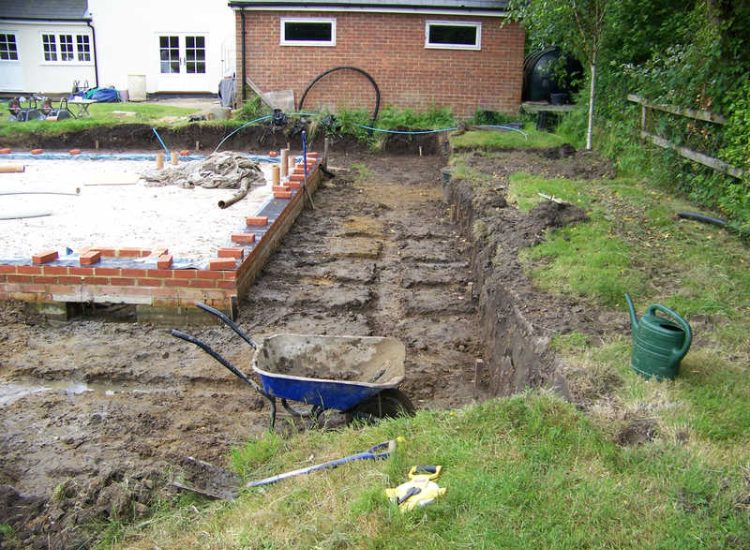 Drainage Layers and Lawn Drainage, Chobham, Surrey - The remit here was to install drainage around a new oak barn build prior to installation and for future drainage safe guards. Extensive lawn areas required land drainage to improve upon consitantly water logged areas of the garden. Garden Drainage - MDB Landscapes