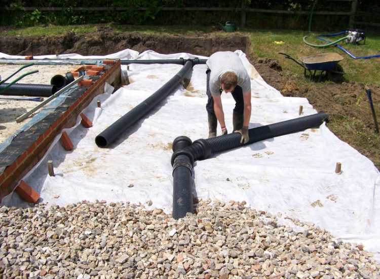 Drainage Layers and Lawn Drainage, Chobham, Surrey - The remit here was to install drainage around a new oak barn build prior to installation and for future drainage safe guards. Extensive lawn areas required land drainage to improve upon consitantly water logged areas of the garden. Garden Drainage - MDB Landscapes