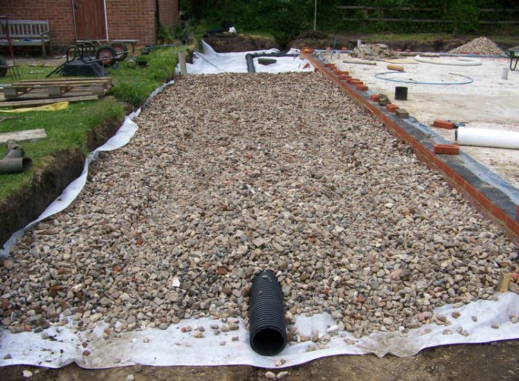 Drainage Layers and Lawn Drainage, Chobham, Surrey - The remit here was to install drainage around a new oak barn build prior to installation and for future drainage safe guards. Extensive lawn areas required land drainage to improve upon consitantly water logged areas of the garden. Garden Drainage - MDB Landscapes