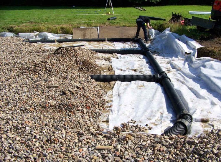 Drainage Layers and Lawn Drainage, Chobham, Surrey - The remit here was to install drainage around a new oak barn build prior to installation and for future drainage safe guards. Extensive lawn areas required land drainage to improve upon consitantly water logged areas of the garden. Garden Drainage - MDB Landscapes