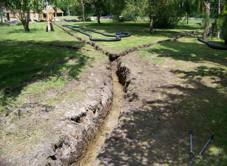 Drainage Layers and Lawn Drainage, Chobham, Surrey - The remit here was to install drainage around a new oak barn build prior to installation and for future drainage safe guards. Extensive lawn areas required land drainage to improve upon consitantly water logged areas of the garden. Garden Drainage - MDB Landscapes