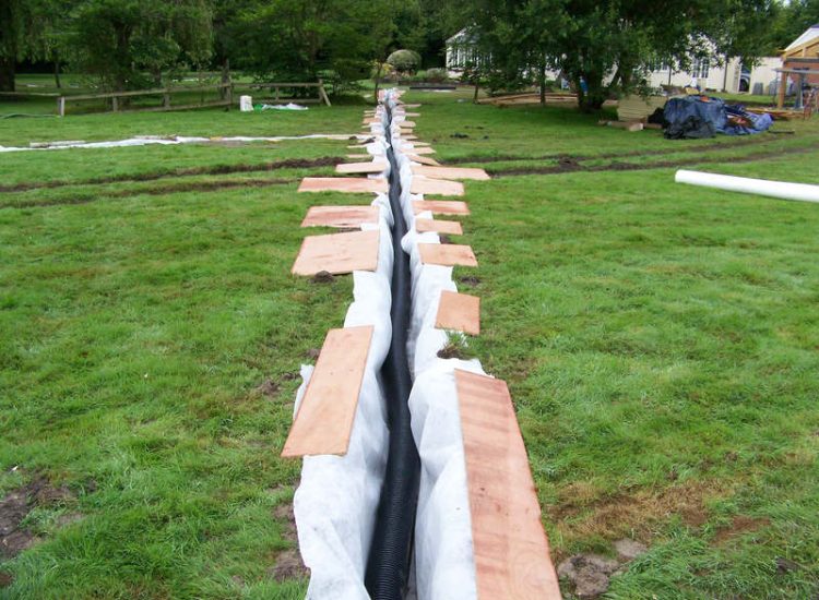 Drainage Layers and Lawn Drainage, Chobham, Surrey - The remit here was to install drainage around a new oak barn build prior to installation and for future drainage safe guards. Extensive lawn areas required land drainage to improve upon consitantly water logged areas of the garden. Garden Drainage - MDB Landscapes