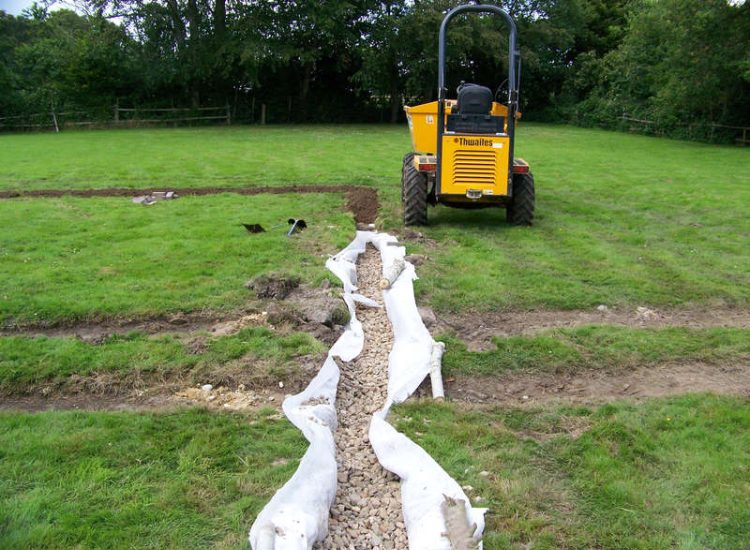 Drainage Layers and Lawn Drainage, Chobham, Surrey - The remit here was to install drainage around a new oak barn build prior to installation and for future drainage safe guards. Extensive lawn areas required land drainage to improve upon consitantly water logged areas of the garden. Garden Drainage - MDB Landscapes