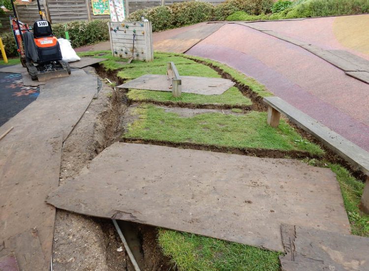 Play Ground Drainage Farnham, Surrey - Water ingress from higher ground created almost unusable play areas for the children in this day nursery. Drainage was installed prior to other contractors laying artificial grass. Garden drainage - MDB Landscapes