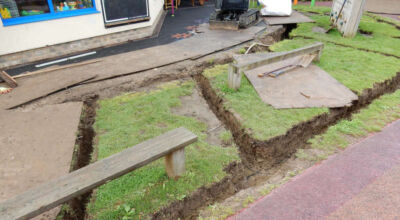 Play Ground Drainage Farnham, Surrey - Water ingress from higher ground created almost unusable play areas for the children in this day nursery. Drainage was installed prior to other contractors laying artificial grass. Garden drainage - MDB Landscapes