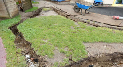 Play Ground Drainage Farnham, Surrey - Water ingress from higher ground created almost unusable play areas for the children in this day nursery. Drainage was installed prior to other contractors laying artificial grass. Garden drainage - MDB Landscapes