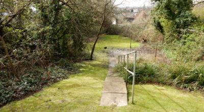 Residential Flats Lawn Drainage London, NW6 - Communal garden areas were constantly flooding leaving unusable and unmanageable saturated lawns. The gardens here were in two levels with both lawns requiring drainage. Extensive land drainage was installed with the oulet point for the drainage within the lower grounds of the garden. Garden Drainage - MDB Landscapes