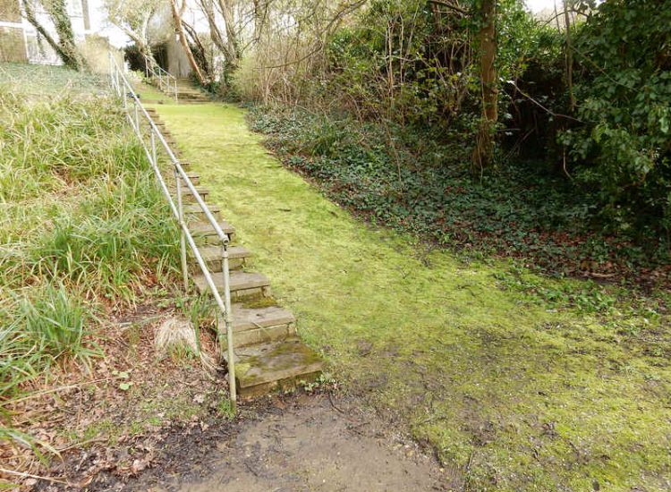 Residential Flats Lawn Drainage London, NW6 - Communal garden areas were constantly flooding leaving unusable and unmanageable saturated lawns. The gardens here were in two levels with both lawns requiring drainage. Extensive land drainage was installed with the oulet point for the drainage within the lower grounds of the garden. Garden Drainage - MDB Landscapes