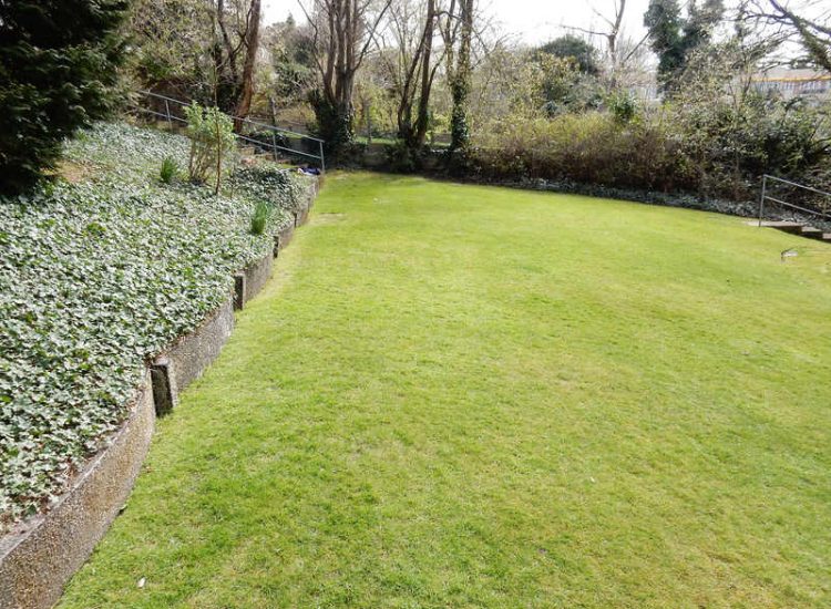 Residential Flats Lawn Drainage London, NW6 - Communal garden areas were constantly flooding leaving unusable and unmanageable saturated lawns. The gardens here were in two levels with both lawns requiring drainage. Extensive land drainage was installed with the oulet point for the drainage within the lower grounds of the garden. Garden Drainage - MDB Landscapes