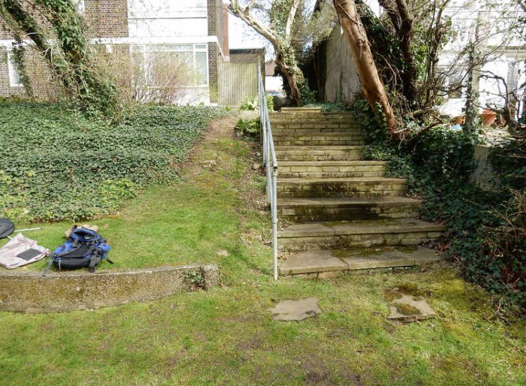 Residential Flats Lawn Drainage London, NW6 - Communal garden areas were constantly flooding leaving unusable and unmanageable saturated lawns. The gardens here were in two levels with both lawns requiring drainage. Extensive land drainage was installed with the oulet point for the drainage within the lower grounds of the garden. Garden Drainage - MDB Landscapes