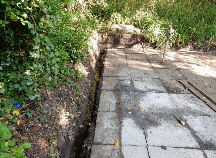 Residential Flats Lawn Drainage London, NW6 - Communal garden areas were constantly flooding leaving unusable and unmanageable saturated lawns. The gardens here were in two levels with both lawns requiring drainage. Extensive land drainage was installed with the oulet point for the drainage within the lower grounds of the garden. Garden Drainage - MDB Landscapes