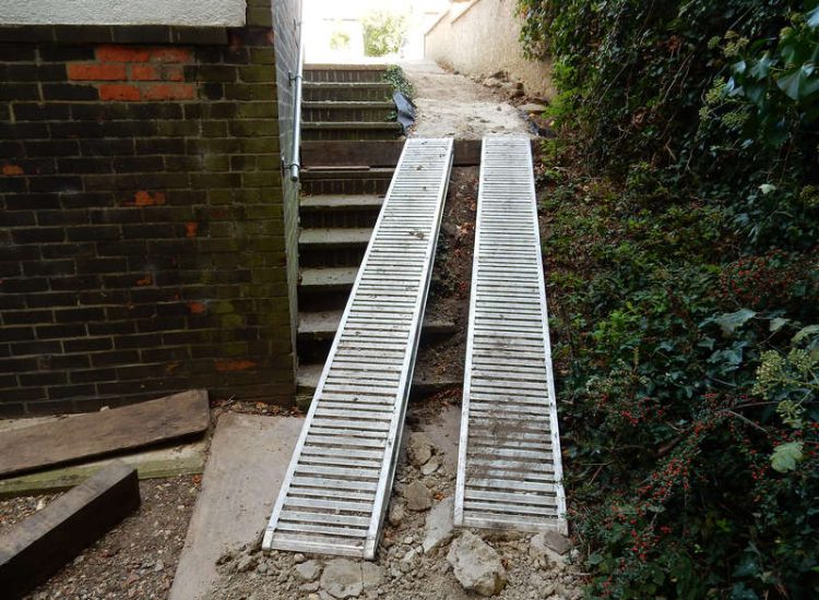 Residential Flats Lawn Drainage London, NW6 - Communal garden areas were constantly flooding leaving unusable and unmanageable saturated lawns. The gardens here were in two levels with both lawns requiring drainage. Extensive land drainage was installed with the oulet point for the drainage within the lower grounds of the garden. Garden Drainage - MDB Landscapes