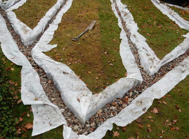 Residential Flats Lawn Drainage London, NW6 - Communal garden areas were constantly flooding leaving unusable and unmanageable saturated lawns. The gardens here were in two levels with both lawns requiring drainage. Extensive land drainage was installed with the oulet point for the drainage within the lower grounds of the garden. Garden Drainage - MDB Landscapes