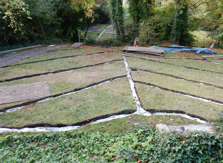 Residential Flats Lawn Drainage London, NW6 - Communal garden areas were constantly flooding leaving unusable and unmanageable saturated lawns. The gardens here were in two levels with both lawns requiring drainage. Extensive land drainage was installed with the oulet point for the drainage within the lower grounds of the garden. Garden Drainage - MDB Landscapes