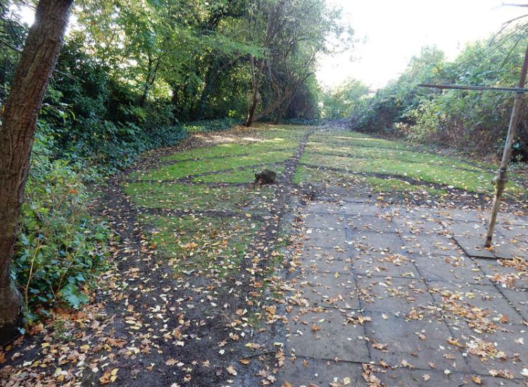 Residential Flats Lawn Drainage London, NW6 - Communal garden areas were constantly flooding leaving unusable and unmanageable saturated lawns. The gardens here were in two levels with both lawns requiring drainage. Extensive land drainage was installed with the oulet point for the drainage within the lower grounds of the garden. Garden Drainage - MDB Landscapes