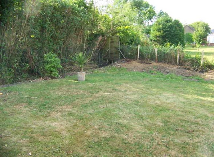 Garden and Lawn Drainage Farnham, Surrey - Drainage was proposed and installed to help capture and divert existing run off from a running brook causing issues with wet and boggy lawn areas. The water was dispersed via newly replaced drainage gullies connected to an existing outlet. Garden Drainage - MDB Landscapes