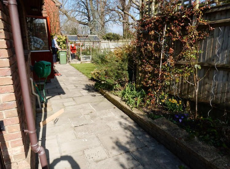 Garden Drainage Great Bookham, Leatherhead, Surrey - An ongoing issue with excessive water finding its way into the cellar of this clients property puting pressure on already installed sump pumps. Perimeter drainage was installed to catch and divert the flow of water helping to reduce the required constant use of the installed pumps. Garden Drainage - MDB Landscapes