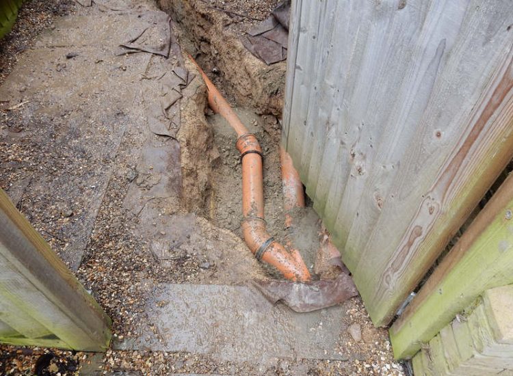 Garden Drainage Great Bookham, Leatherhead, Surrey - An ongoing issue with excessive water finding its way into the cellar of this clients property puting pressure on already installed sump pumps. Perimeter drainage was installed to catch and divert the flow of water helping to reduce the required constant use of the installed pumps. Garden Drainage - MDB Landscapes